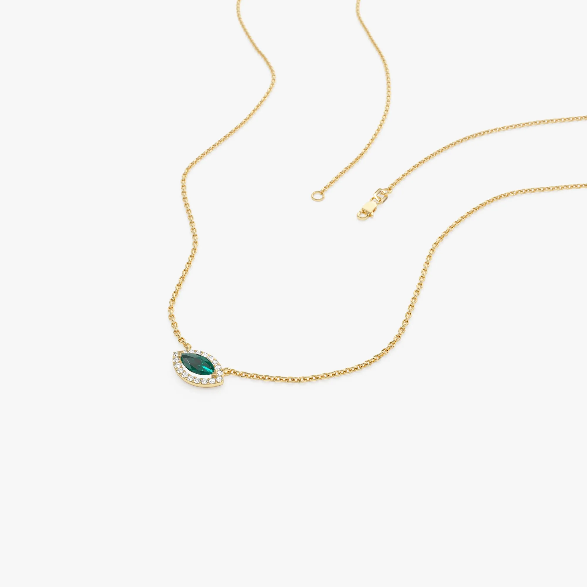 14k Marquise Emerald with Halo Diamond Setting