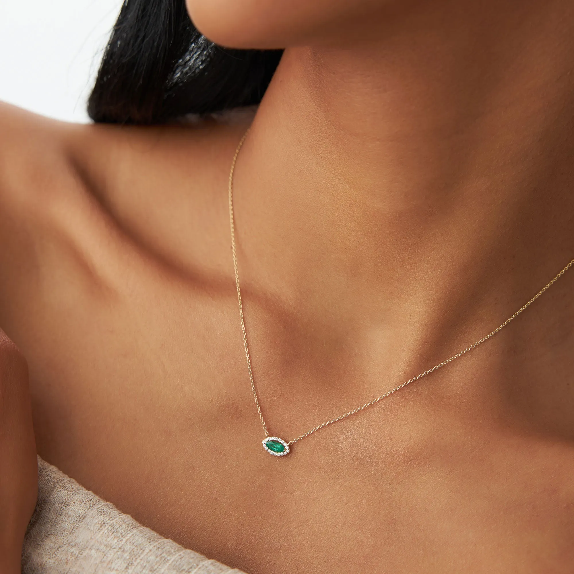 14k Marquise Emerald with Halo Diamond Setting