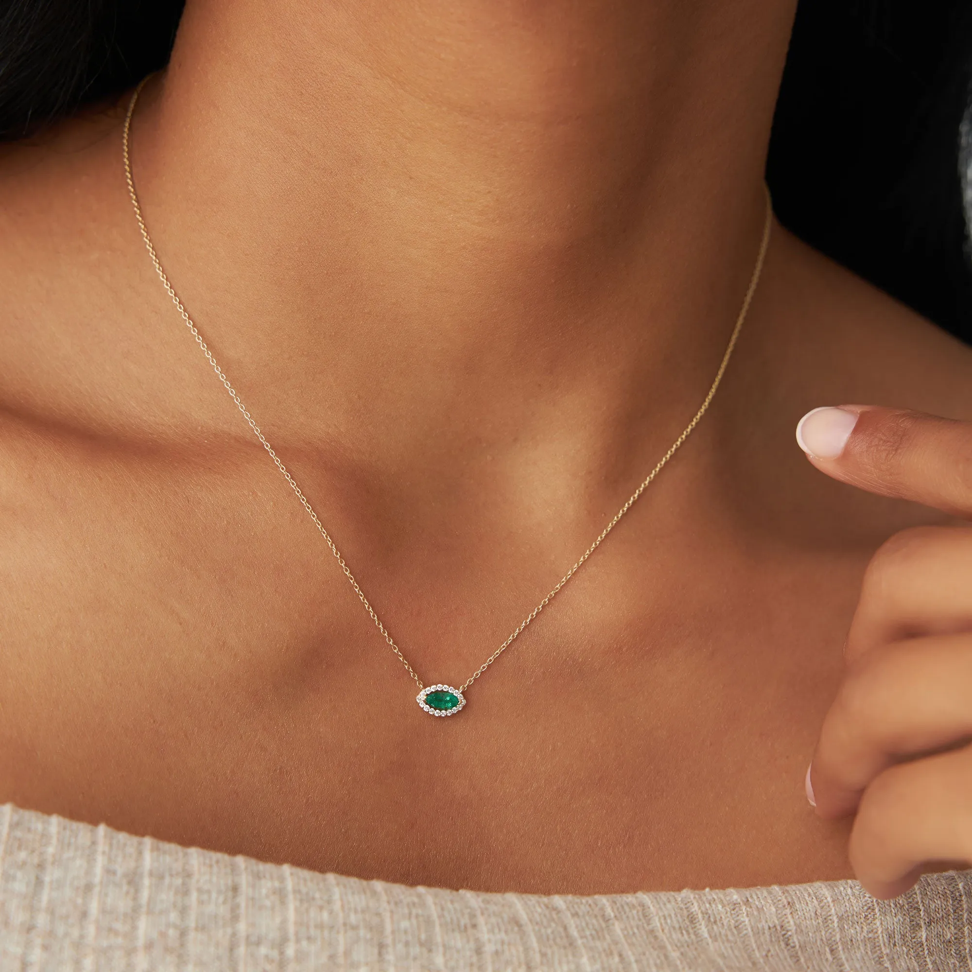 14k Marquise Emerald with Halo Diamond Setting